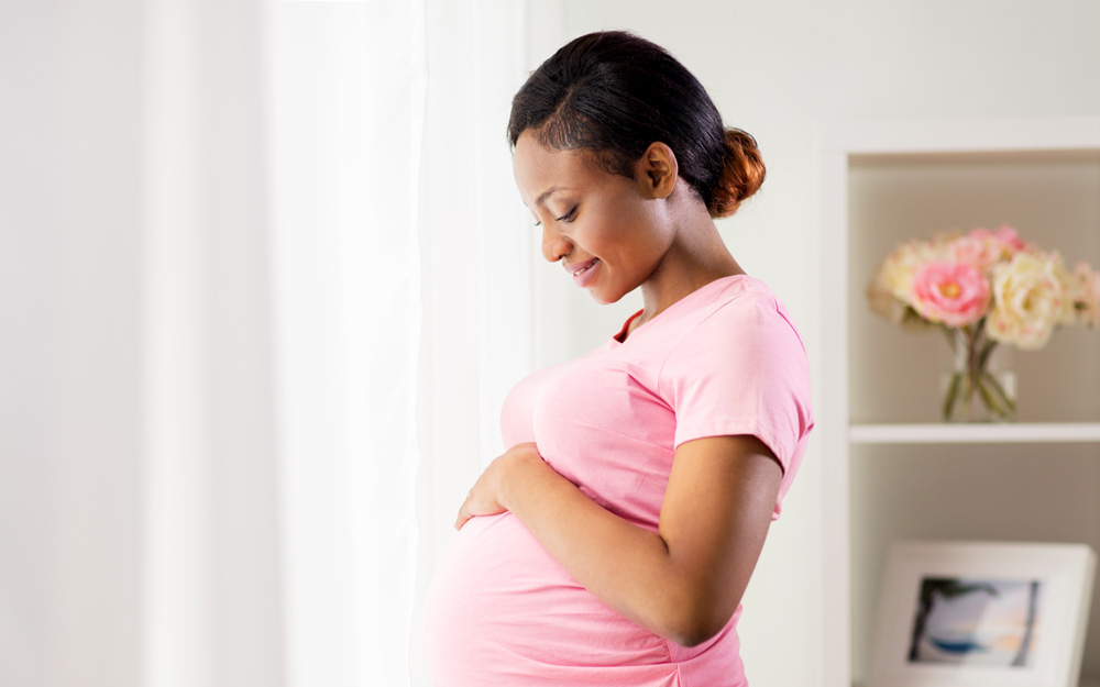 Smiling and healthy pregnant woman